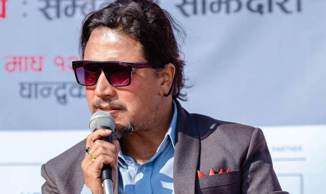 दीपकराज गिरीको व्यङ्ग्य: शेरबहादुर प्रधानाध्यापक भएको भए थर्डलाई फर्स्ट ब्वाइ बनाइदिने रहेछन्